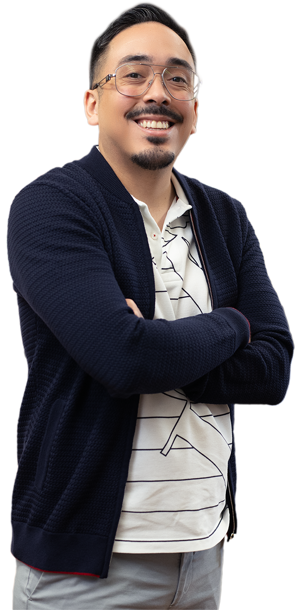 Confident young man smiling with arms crossed