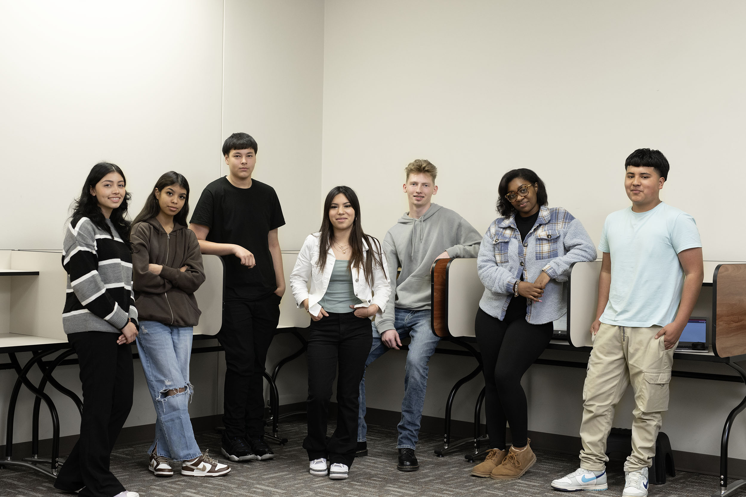 Diverse group of students standing in classroom