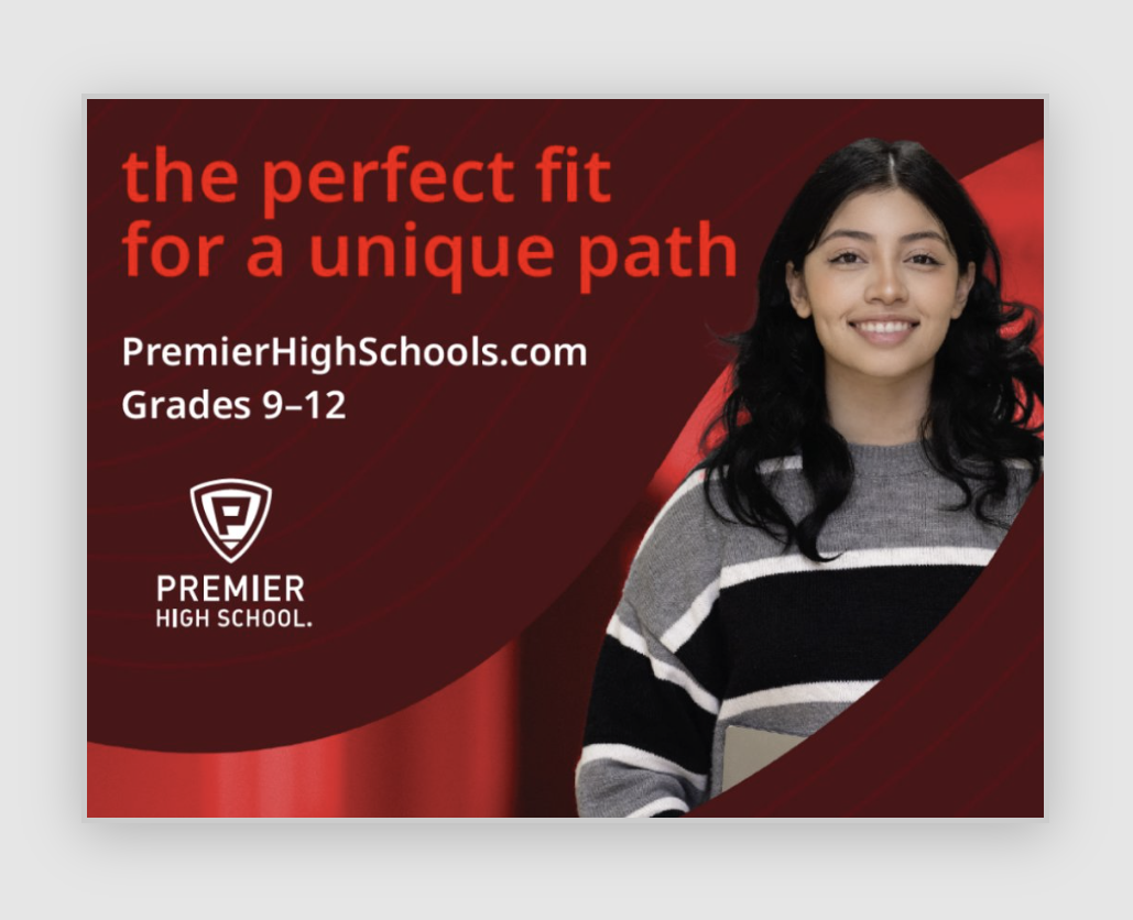 Smiling student with Premier High School advertisement