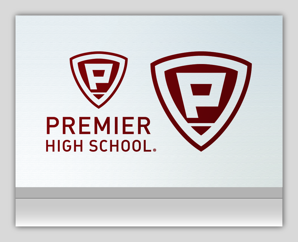 Premier High School logo on a silver background.