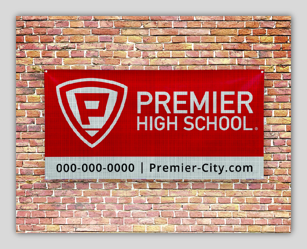 Premier High School banner on brick wall.