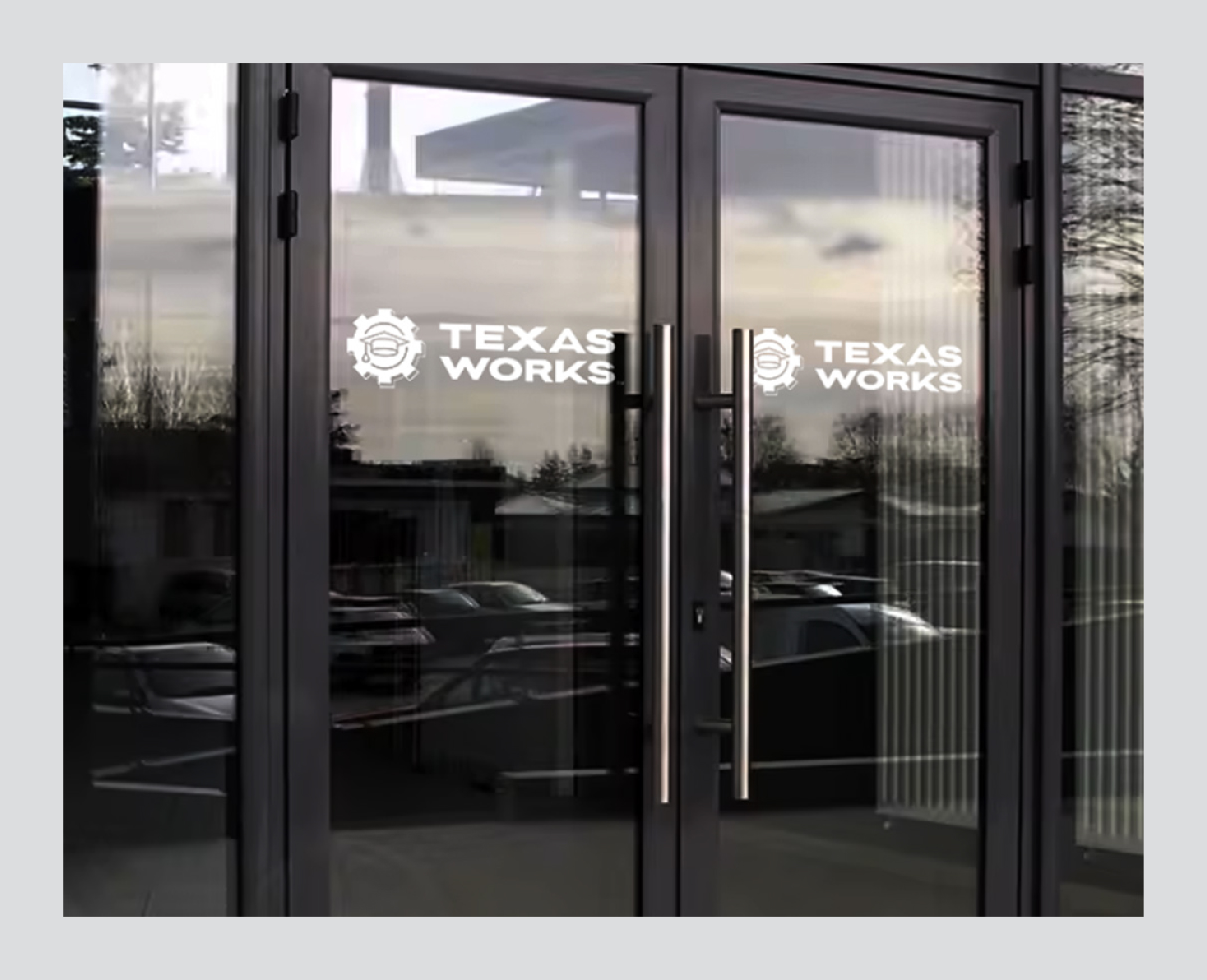 Entrance doors with Texas Works signage visible